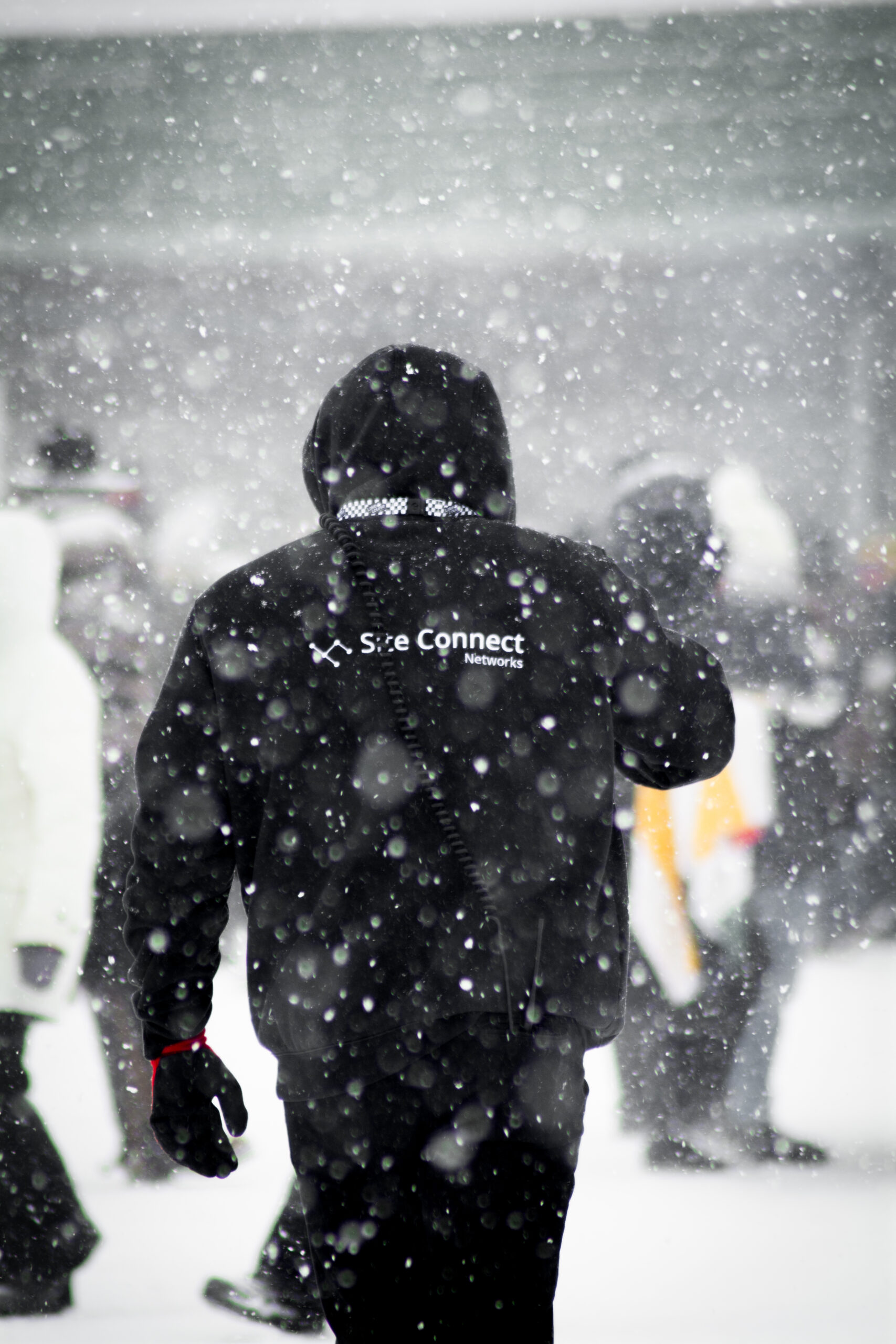 A SiteConnect Expert walks in the snow